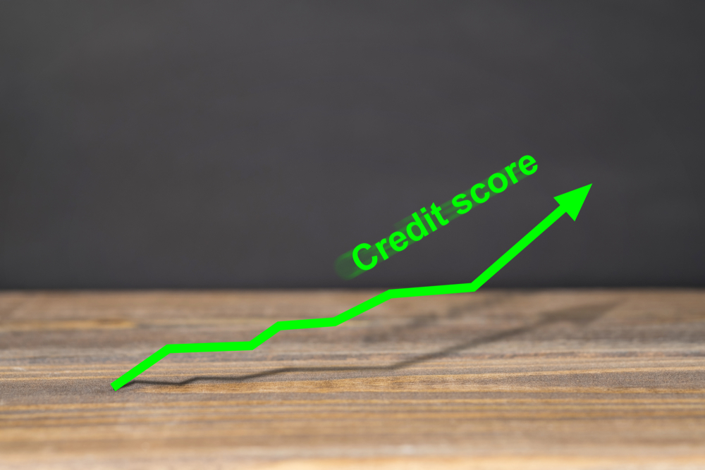 graph shows excellent credit score on wooden surface